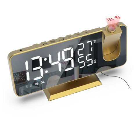 A imagem mostra o relógio de mesa na cor ouro.