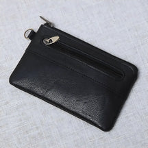 Porta-cartões preto em couro com zíper e design compacto