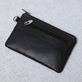 Porta-cartões preto em couro com zíper e design compacto