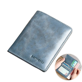Carteira de couro azul vintage, compacta e com proteção RFID para cartões.