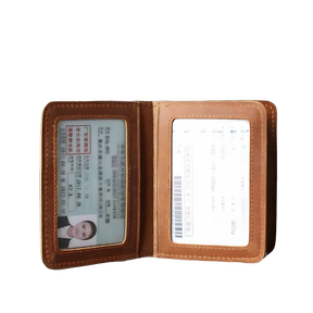 Carteira de couro com dois compartimentos para documentos e identificação.