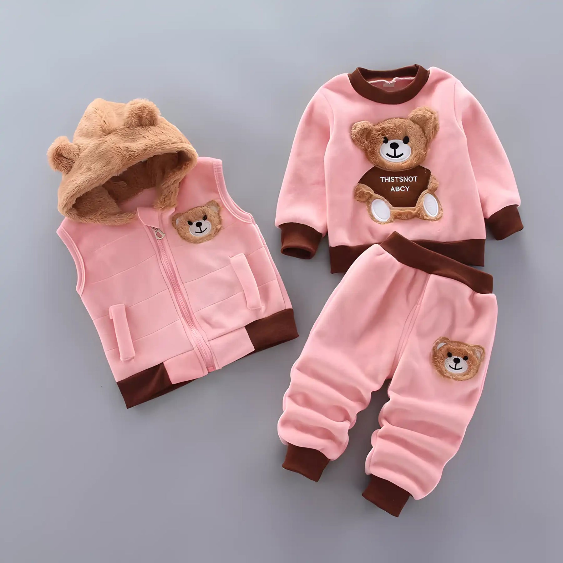 Conjunto moletom infantil unissex com blusa, calça e colete na cor rosa.